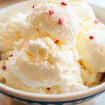 Homemade snow cream recipe – a creamy winter dessert made with fresh snow, milk, sugar, and vanilla, topped with colorful sprinkles.